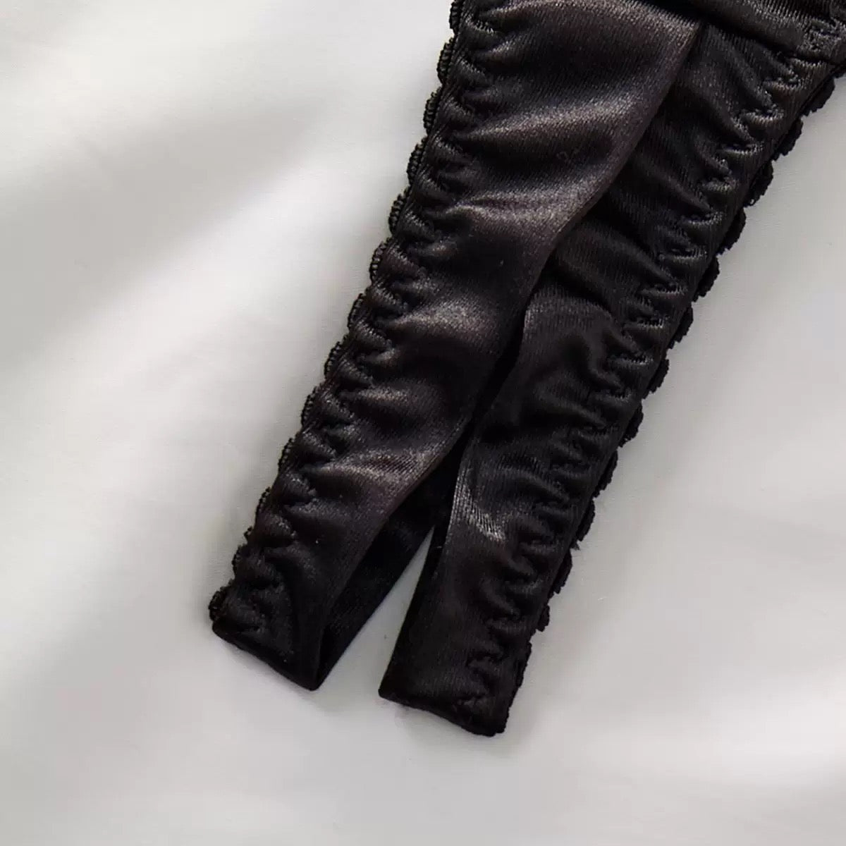 black bow thong lingerie close up detail fabric texture