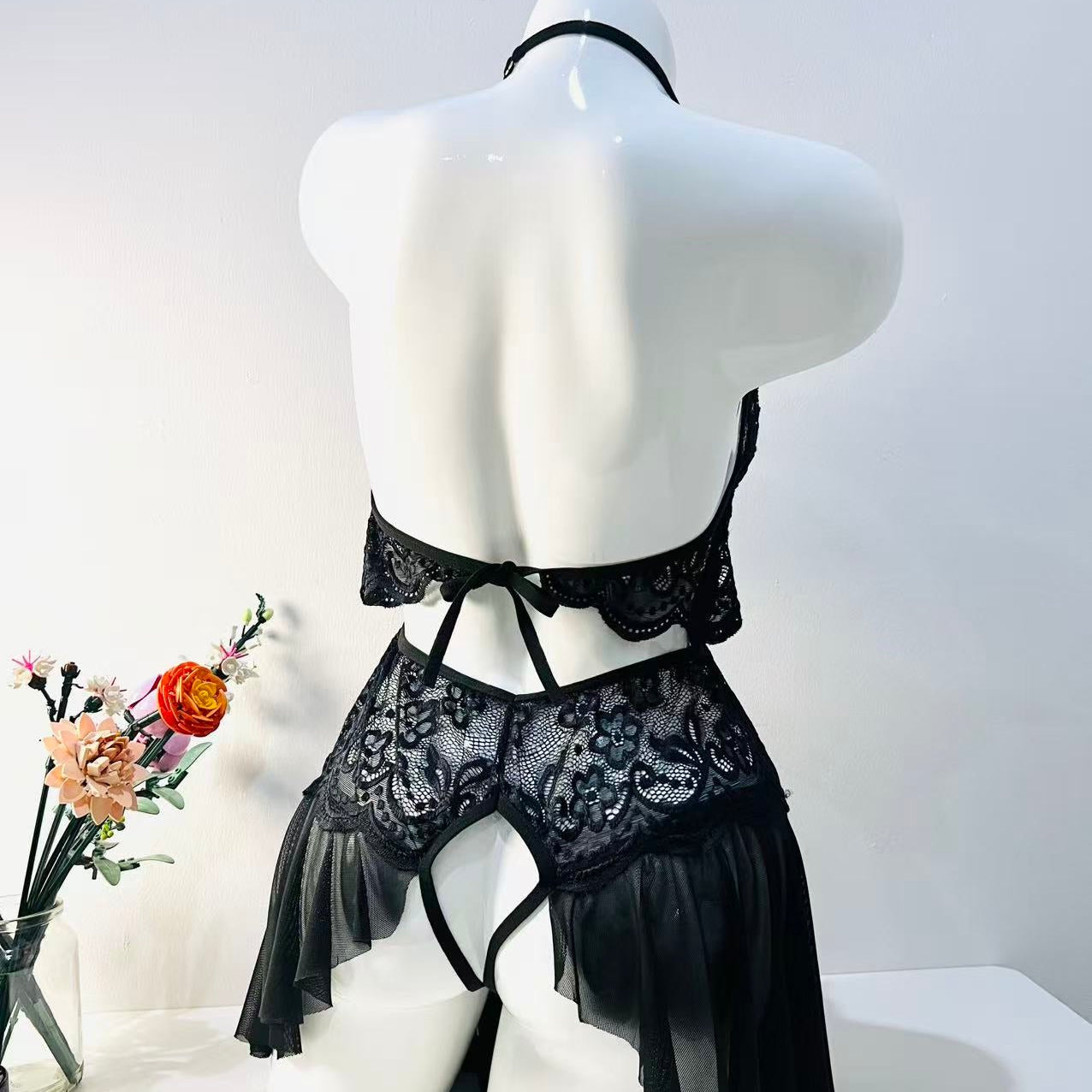 black lace bodysuit back view showing clean lines and smooth silhouette