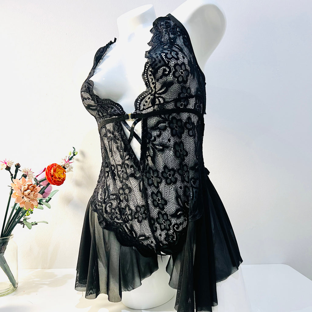 black lace bodysuit worn by model front view elegant and sheer lingerie look