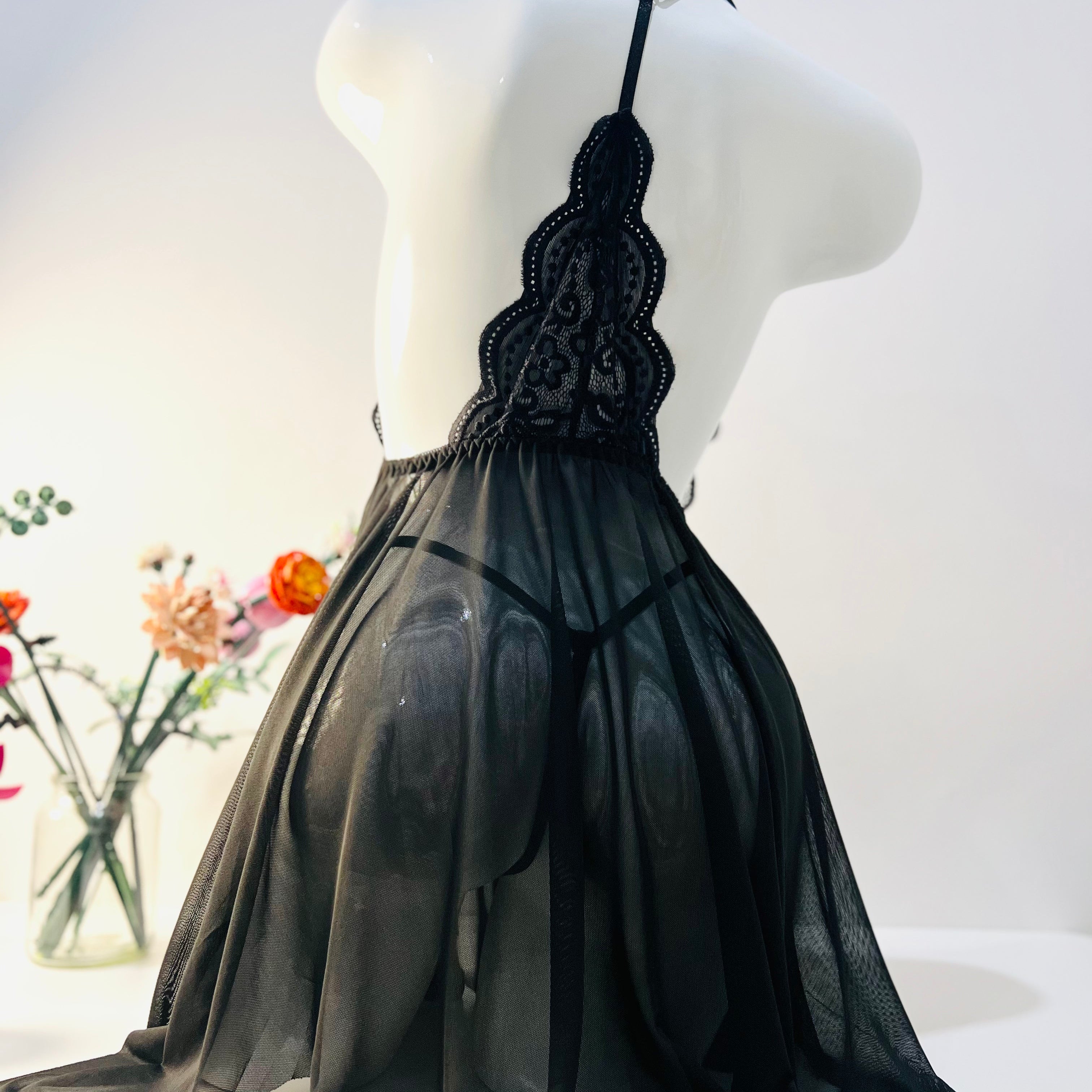 black lace sleep dress back view highlighting thong fit and smooth silhouette design