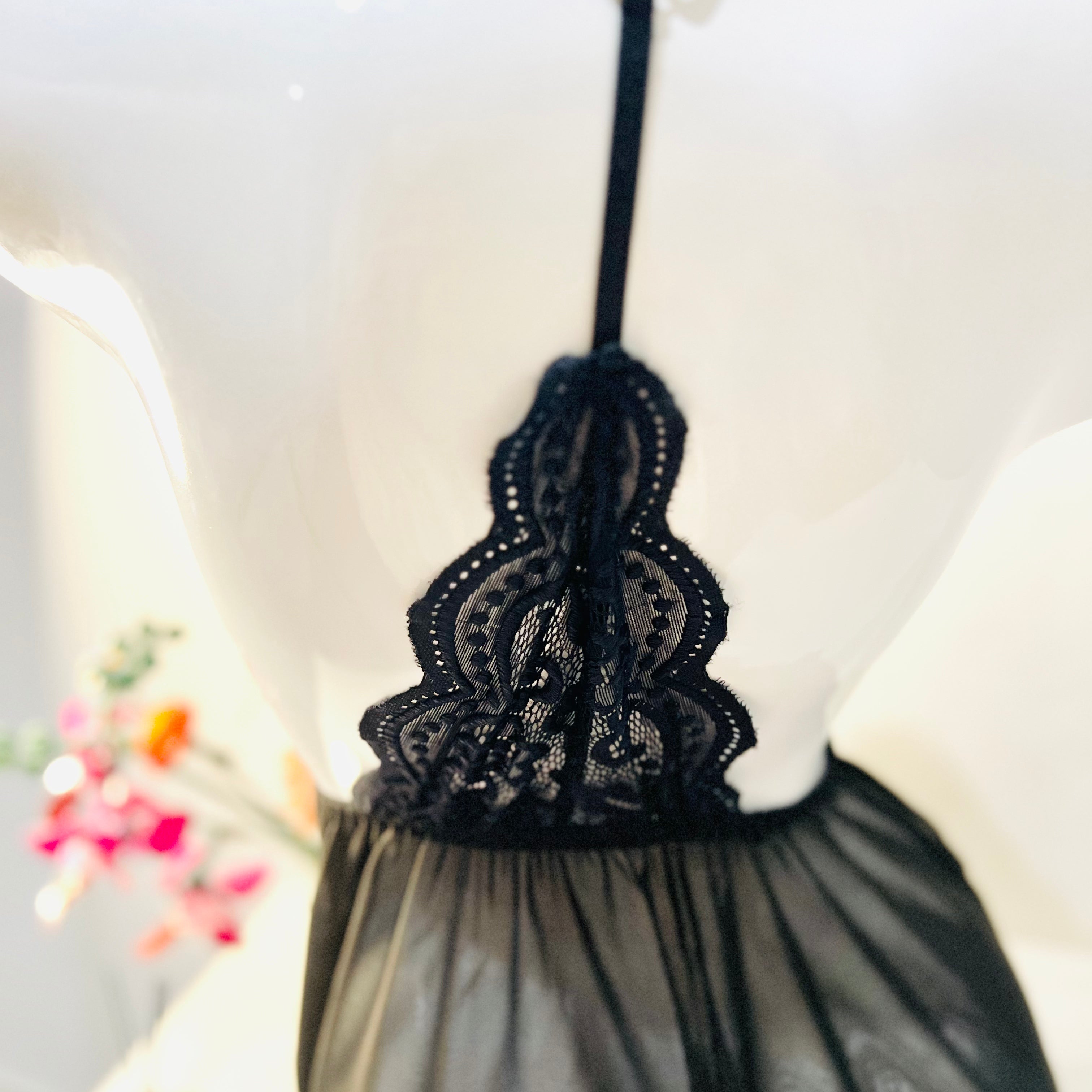 back strap detail on black lace sleep dress showing adjustable elegant design