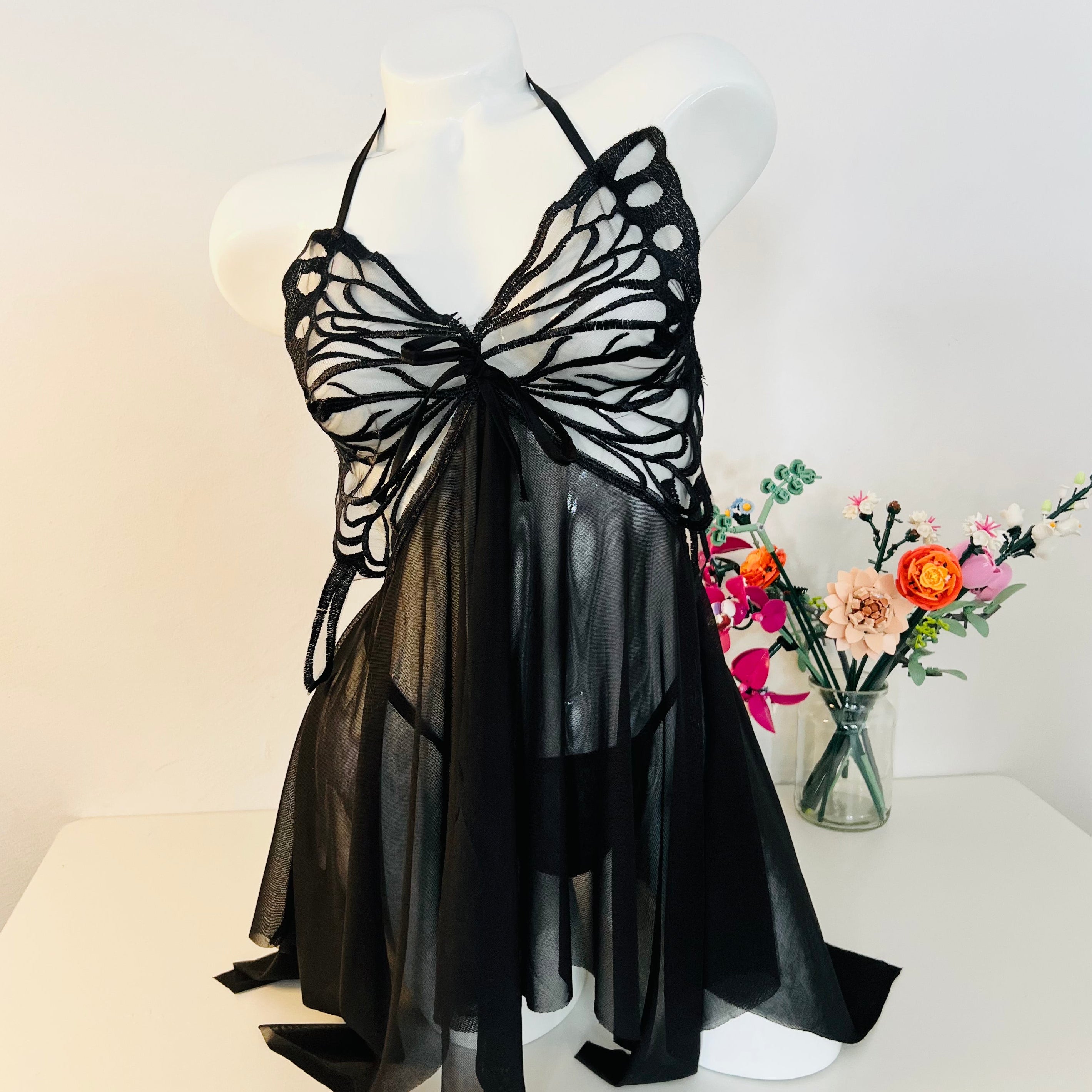 black lace sleep dress worn by model front view classic and elegant lingerie look