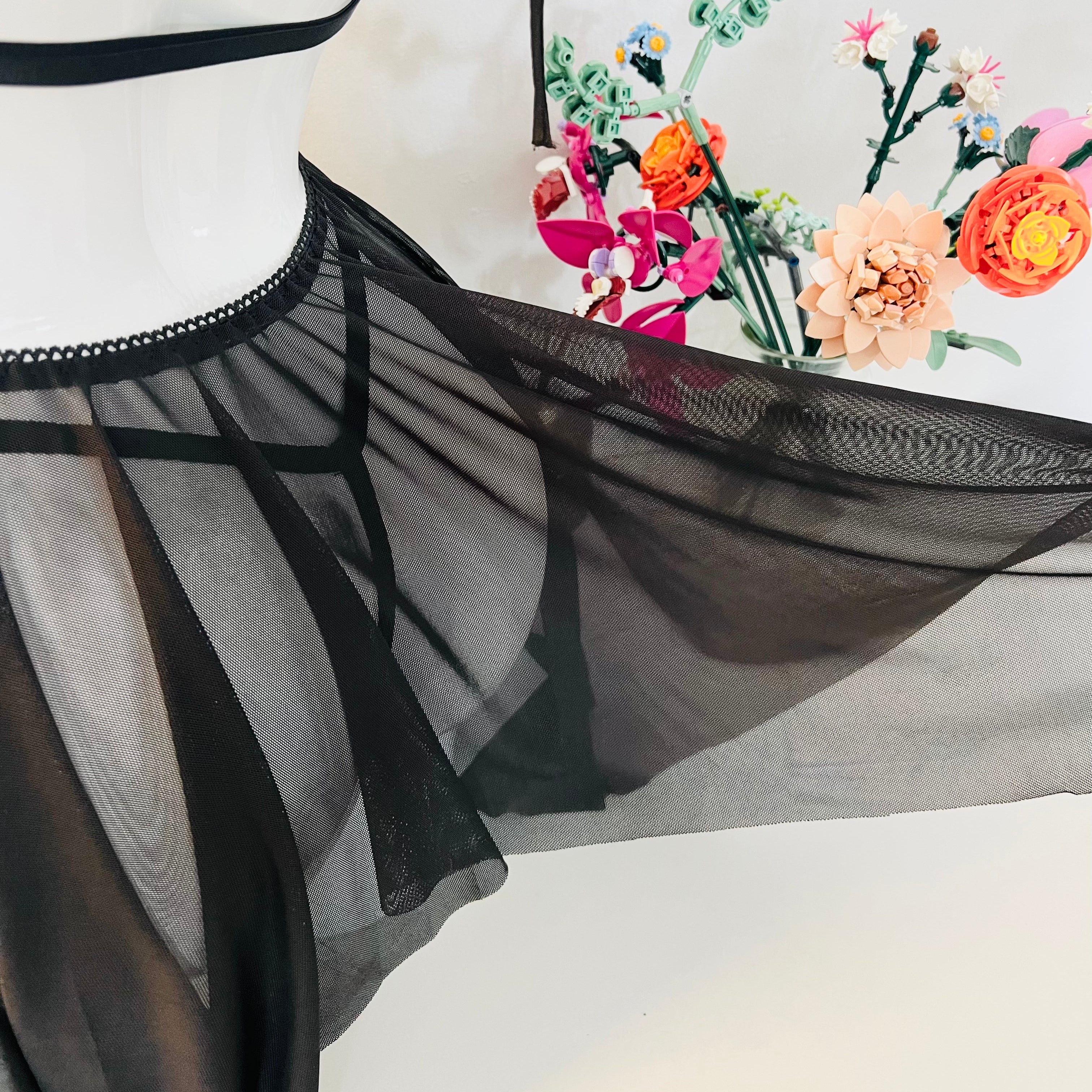 close up of black lace hem fabric showing soft texture and lightweight feel