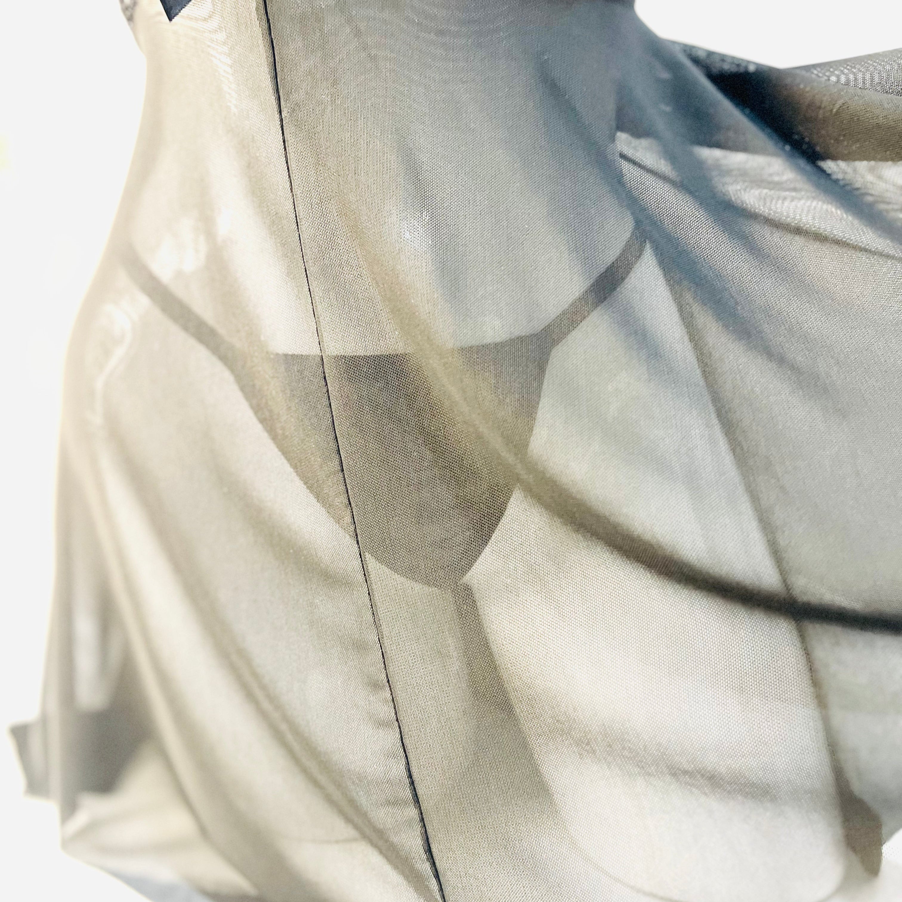 mesh fabric hem detail of black lace sleep dress showing soft sheer texture