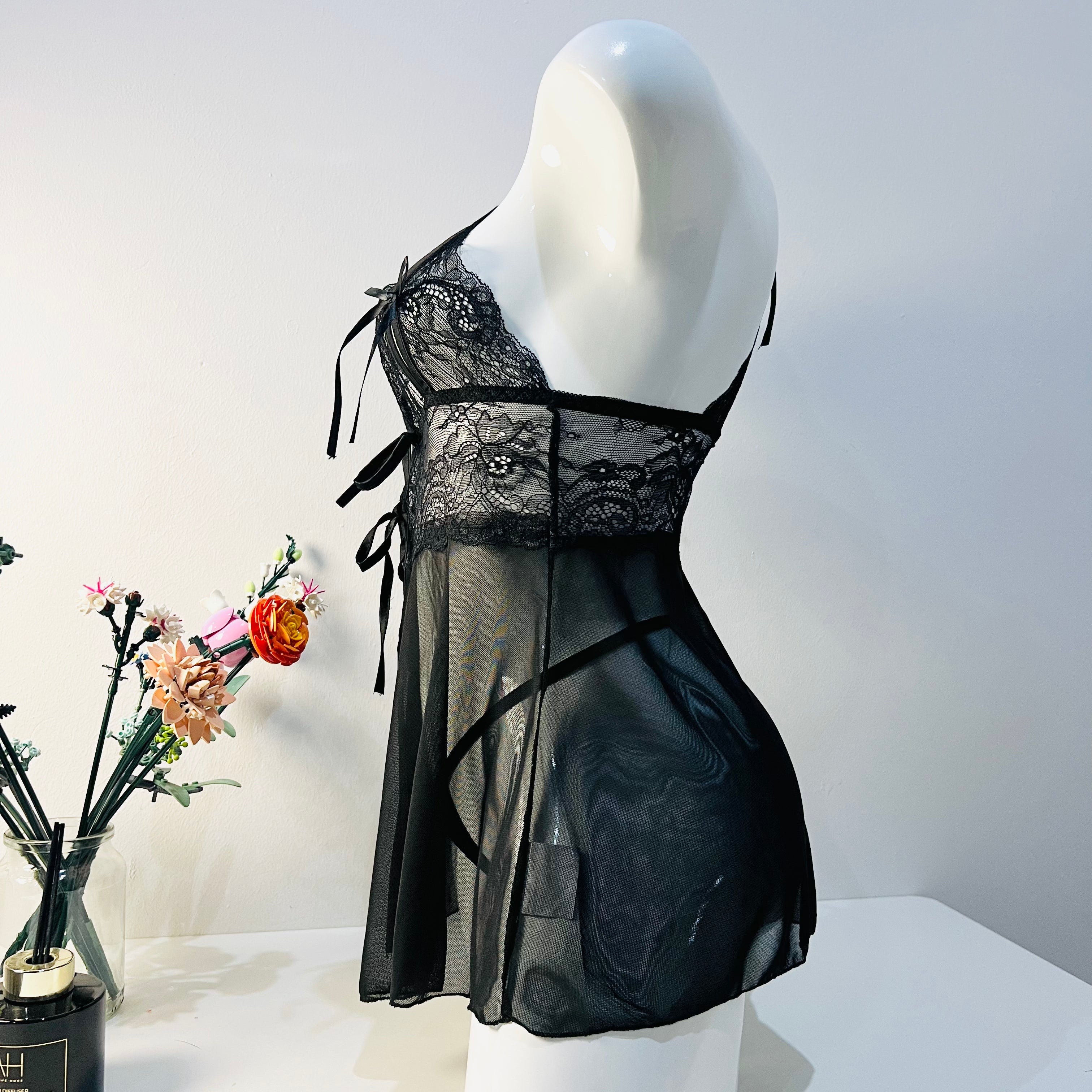 side view of black lace sleep dress highlighting body fit and soft silhouette