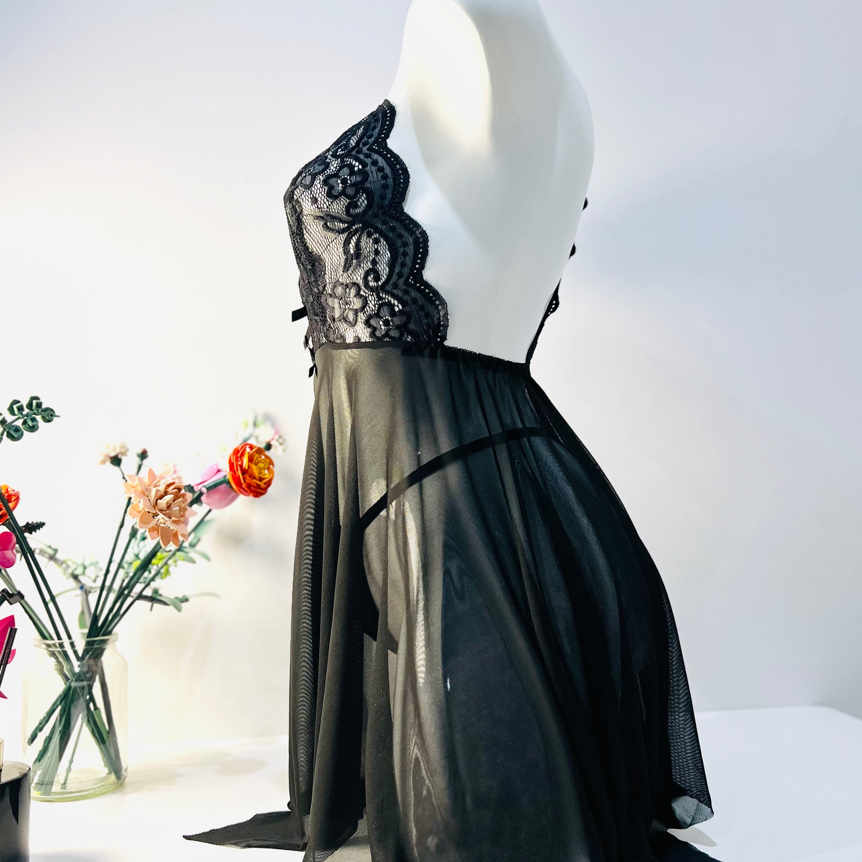 side view of black lace sleep dress showing soft flow and natural body shape