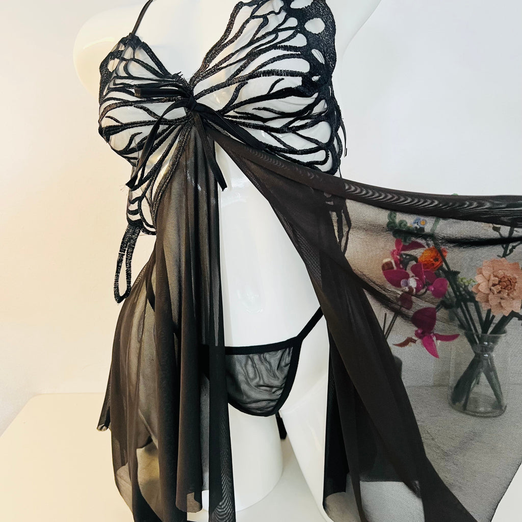 side slit detail on black lace sleep dress showing movement and elegant cut