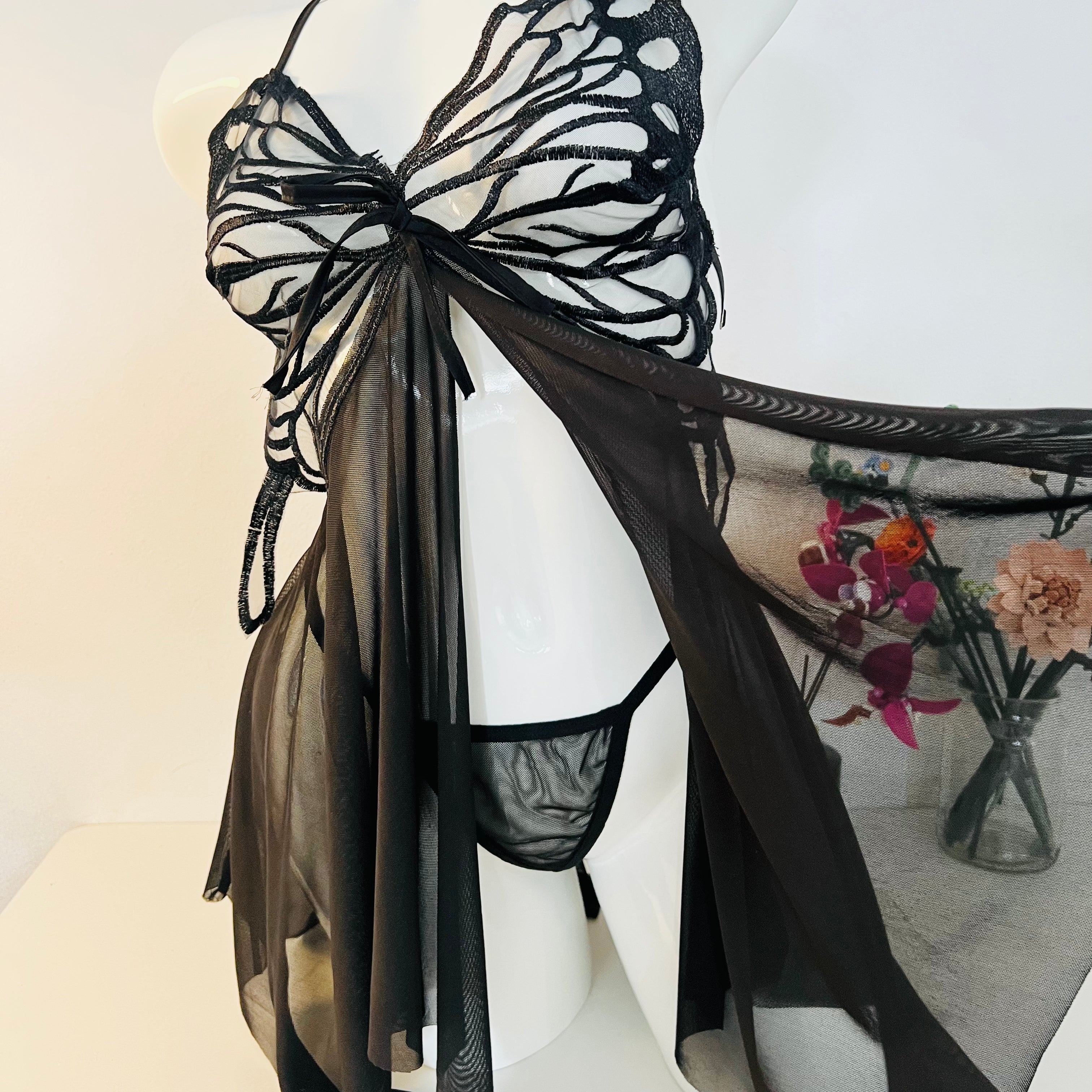 side slit detail on black lace sleep dress showing movement and elegant cut