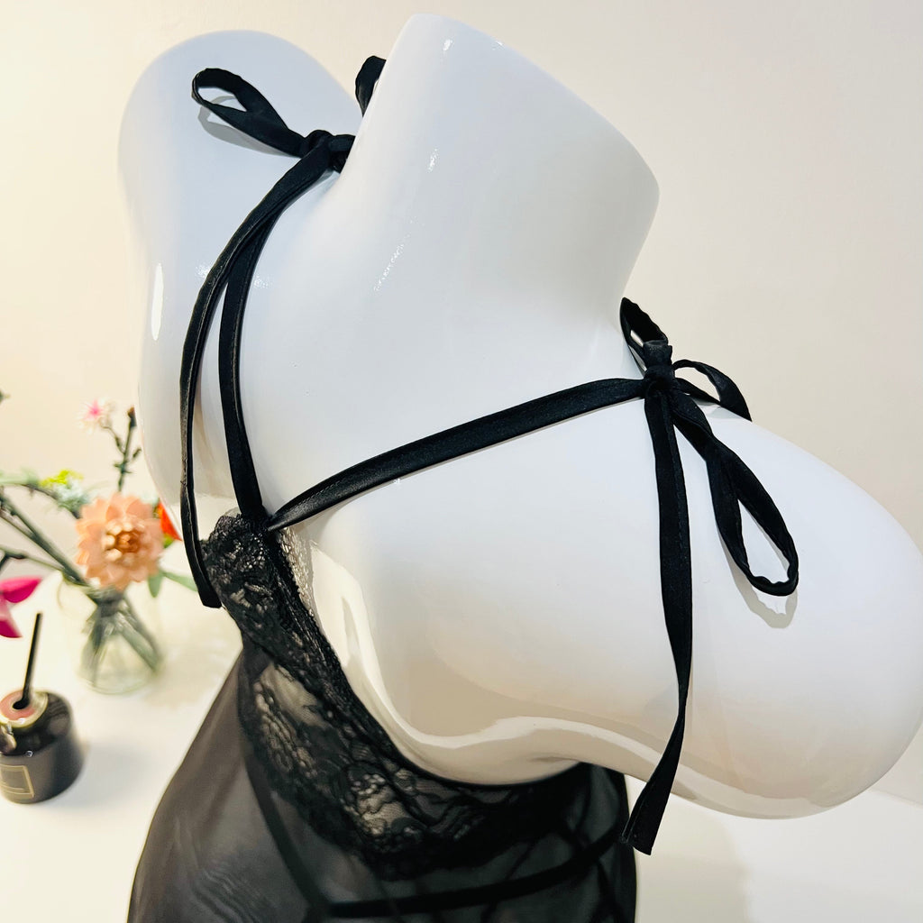 close up of adjustable shoulder straps on black lace sleep dress