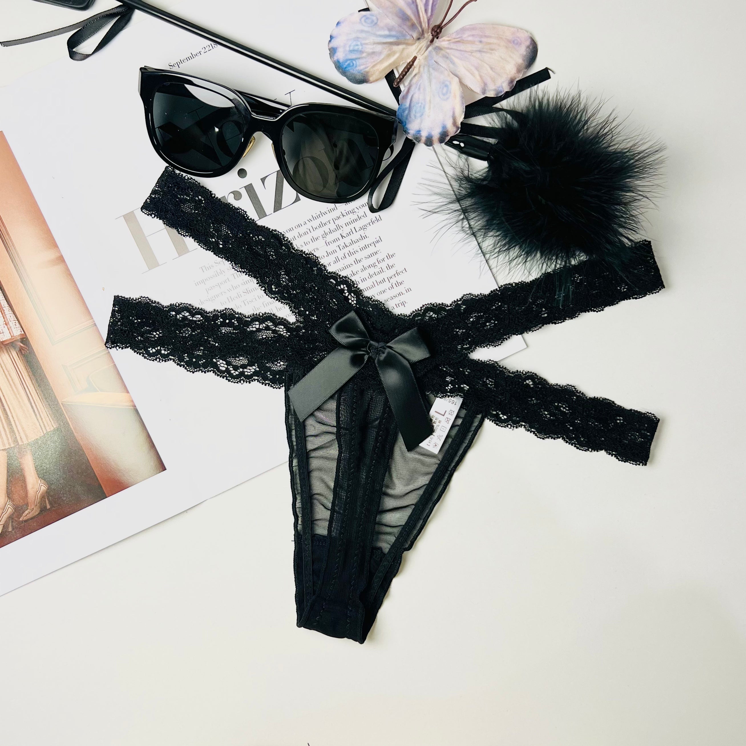 black lace thong lingerie flat lay front view underwear