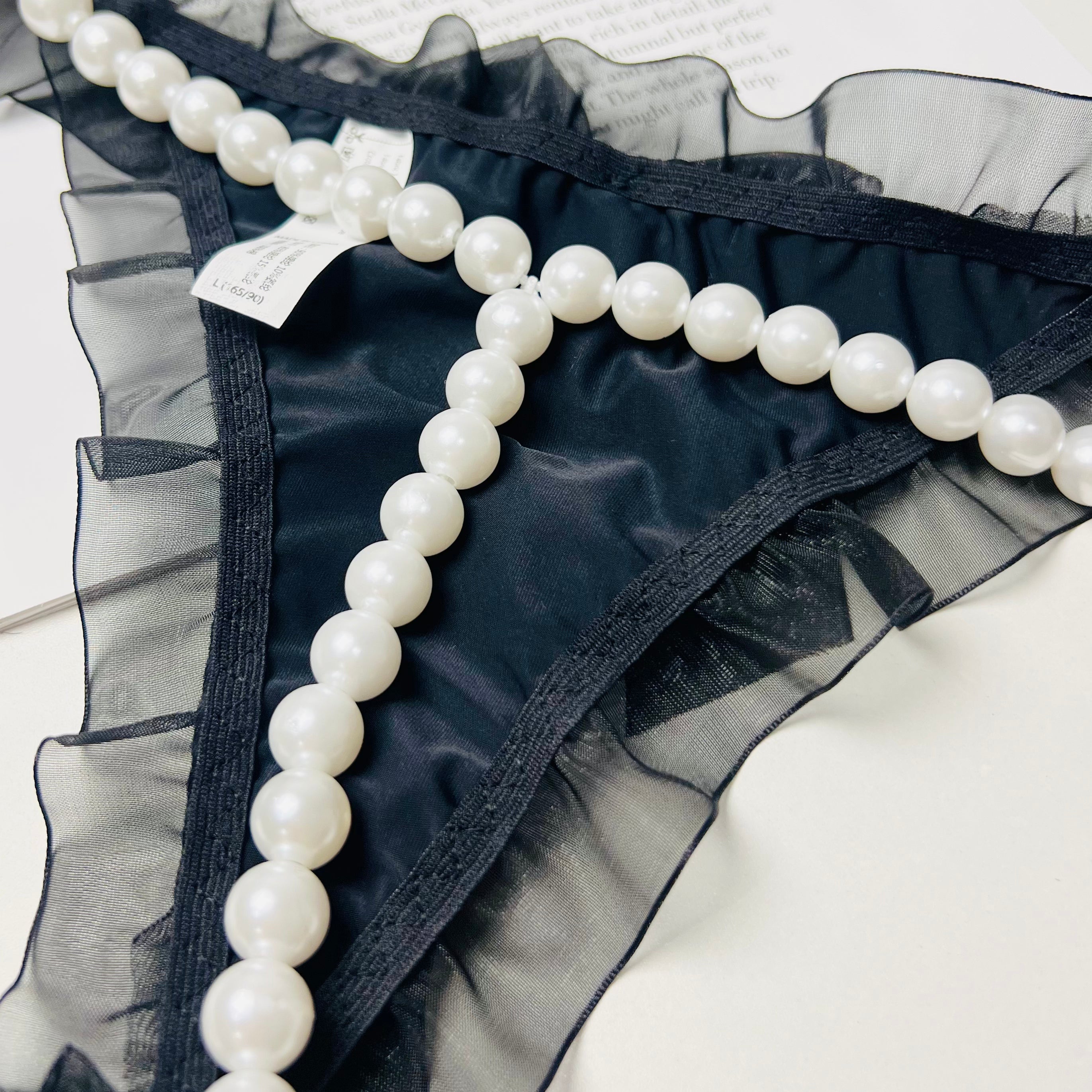 black pearl bow thong lingerie pearl decoration close up detail
