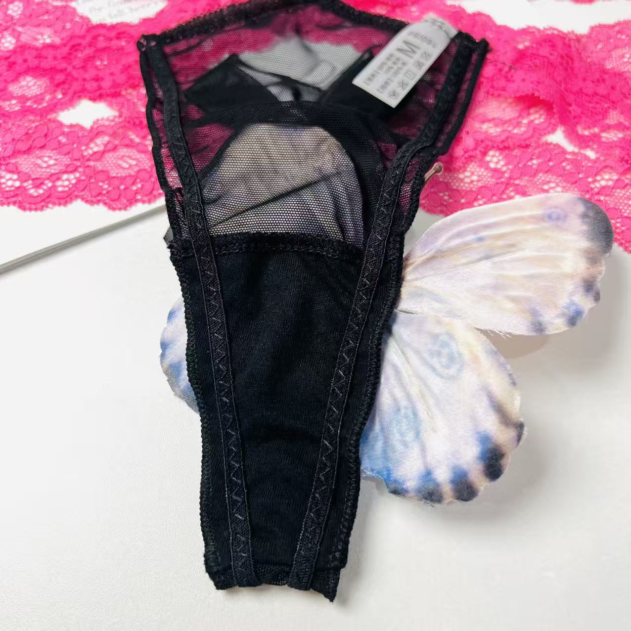 black rose lace thong lingerie crotch fabric close up stitching detail