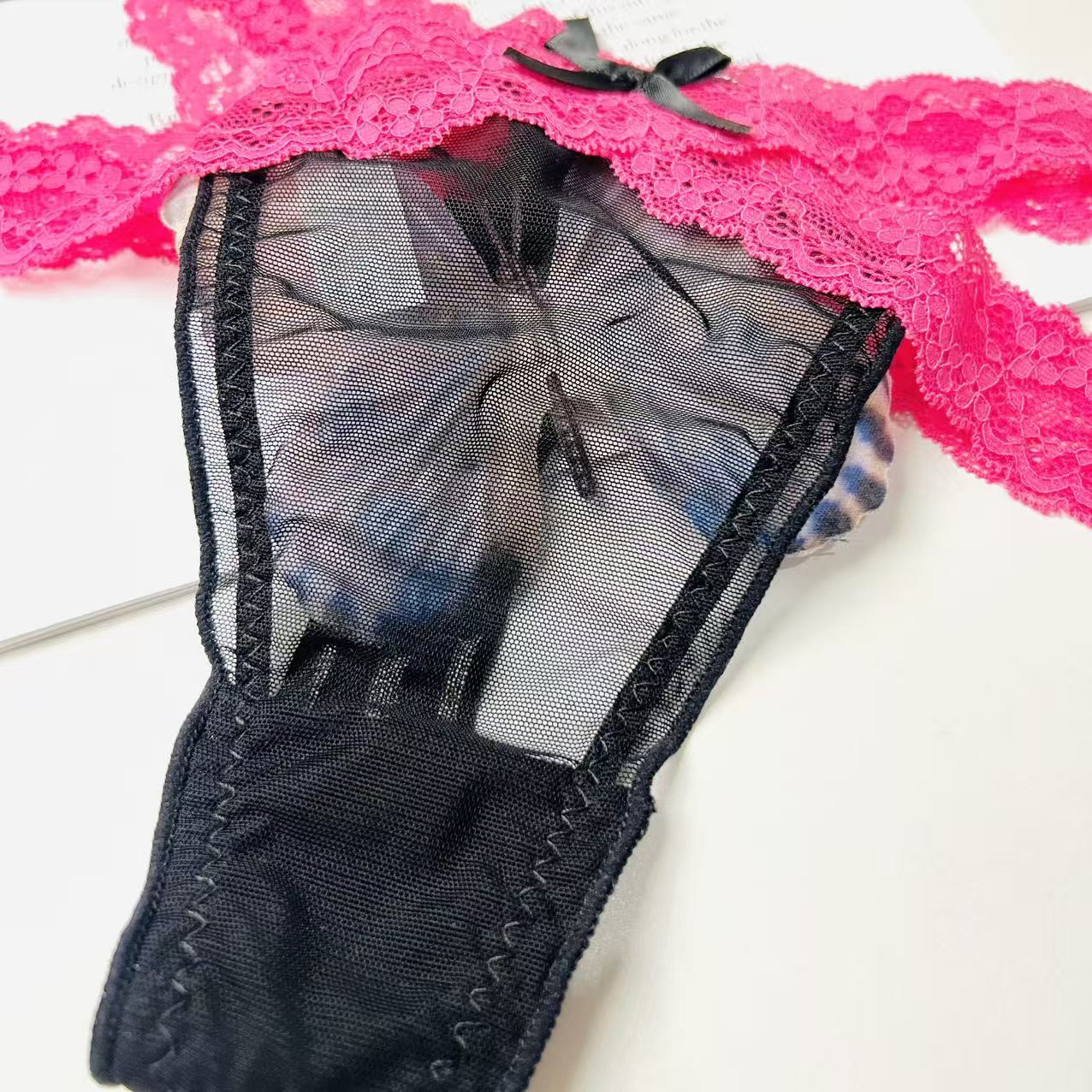 black rose lace thong lingerie fabric close up texture detail