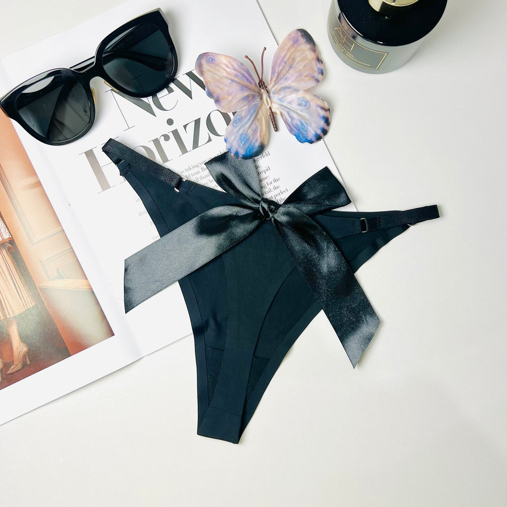 black silk bow thong lingerie flat lay back view underwear
