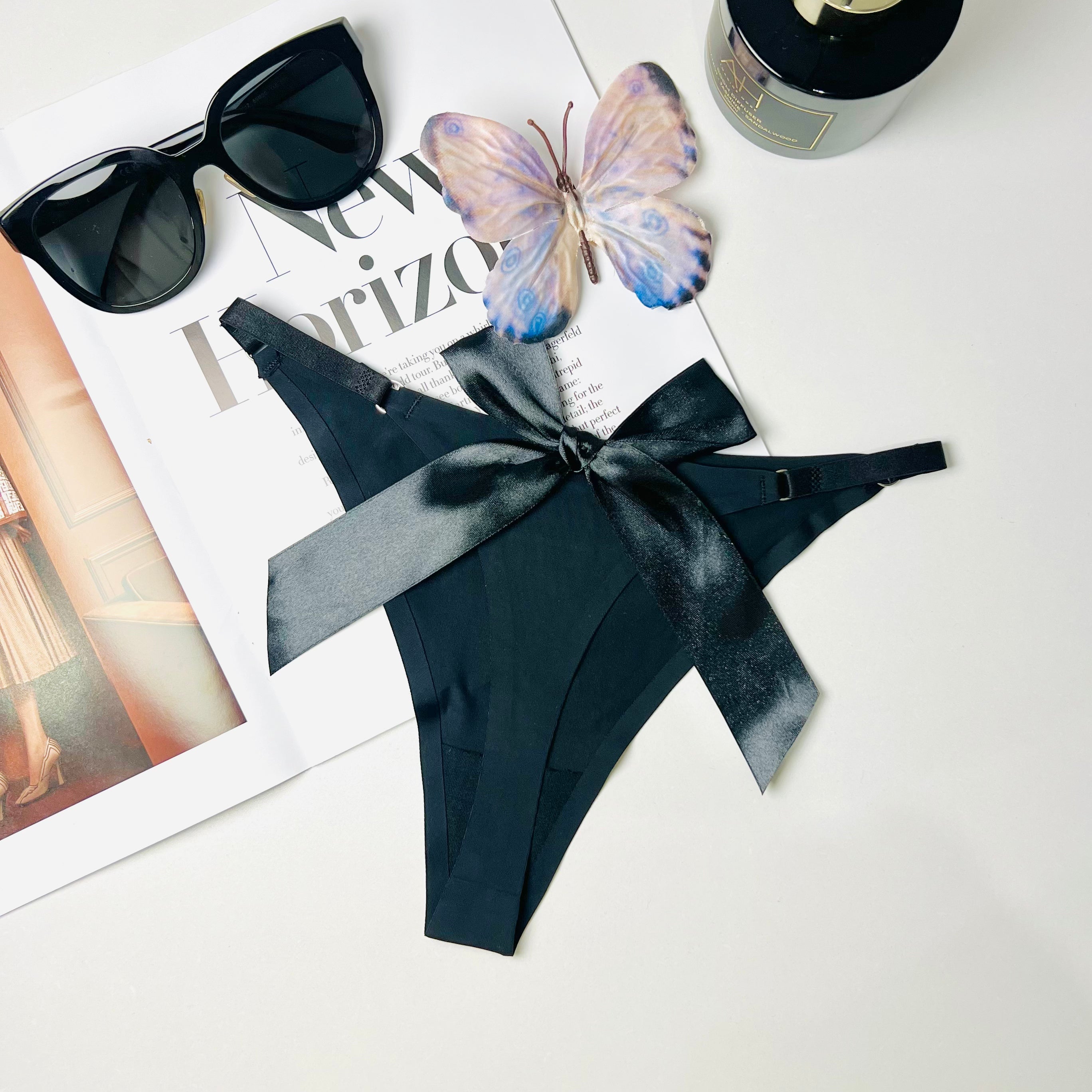black silk bow thong lingerie flat lay back view underwear