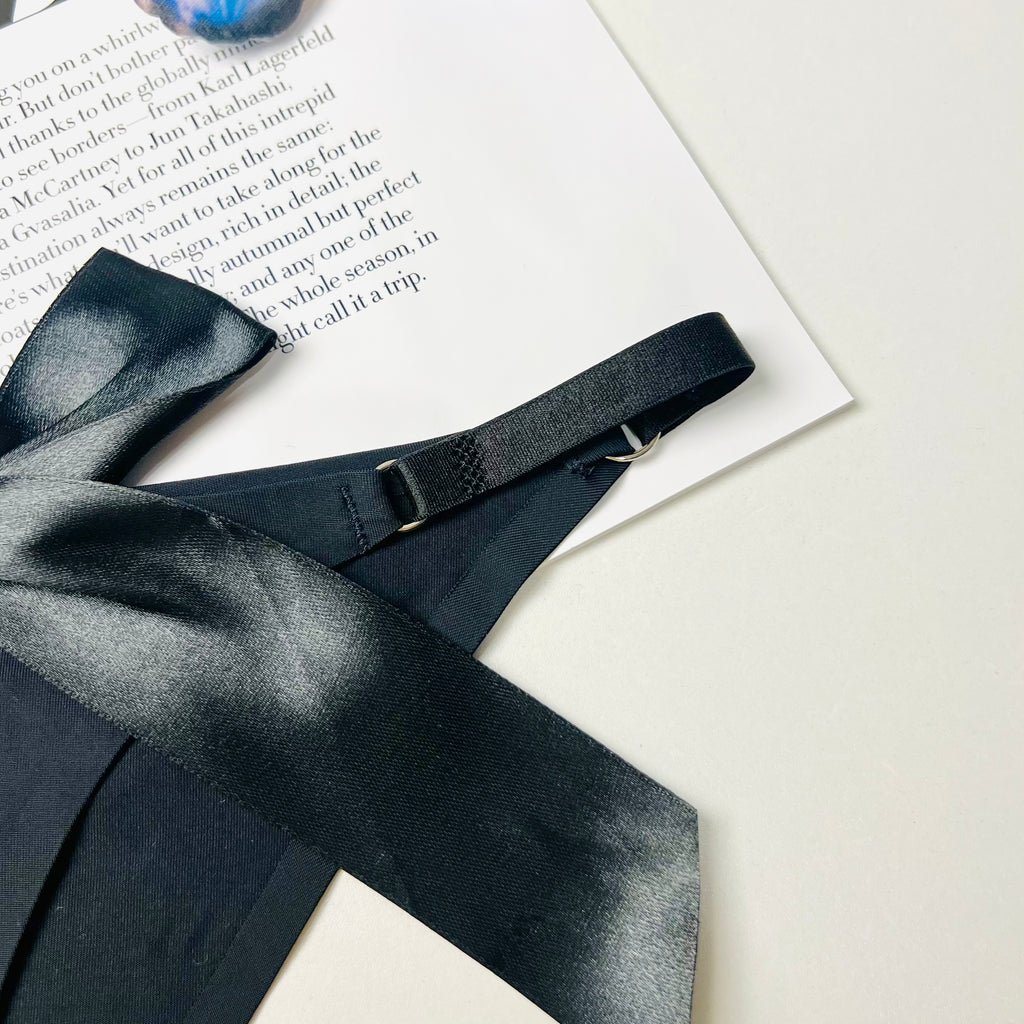 black silk bow thong lingerie stitching detail close up design