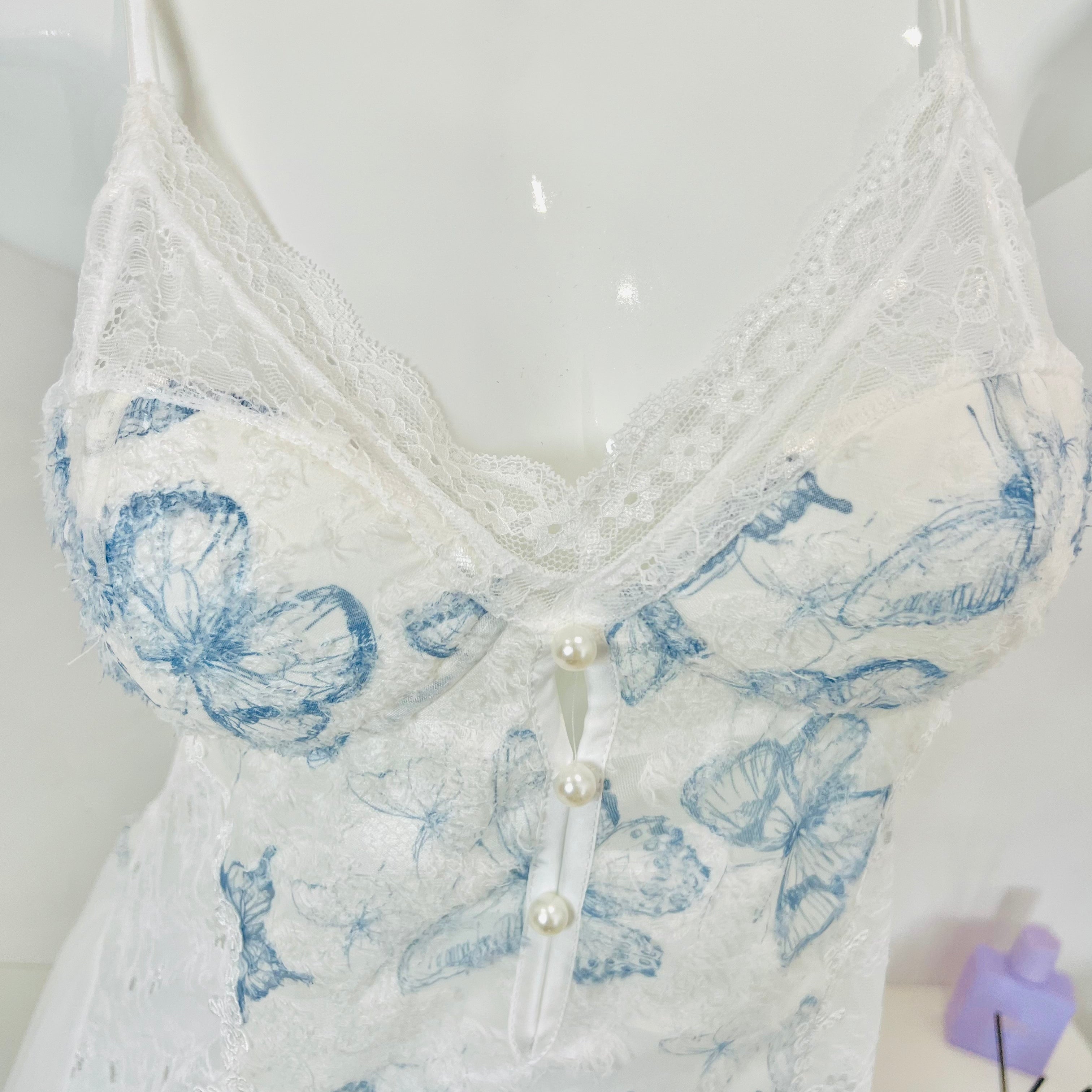 blue lace sleep dress bust detail close up lace embroidery texture