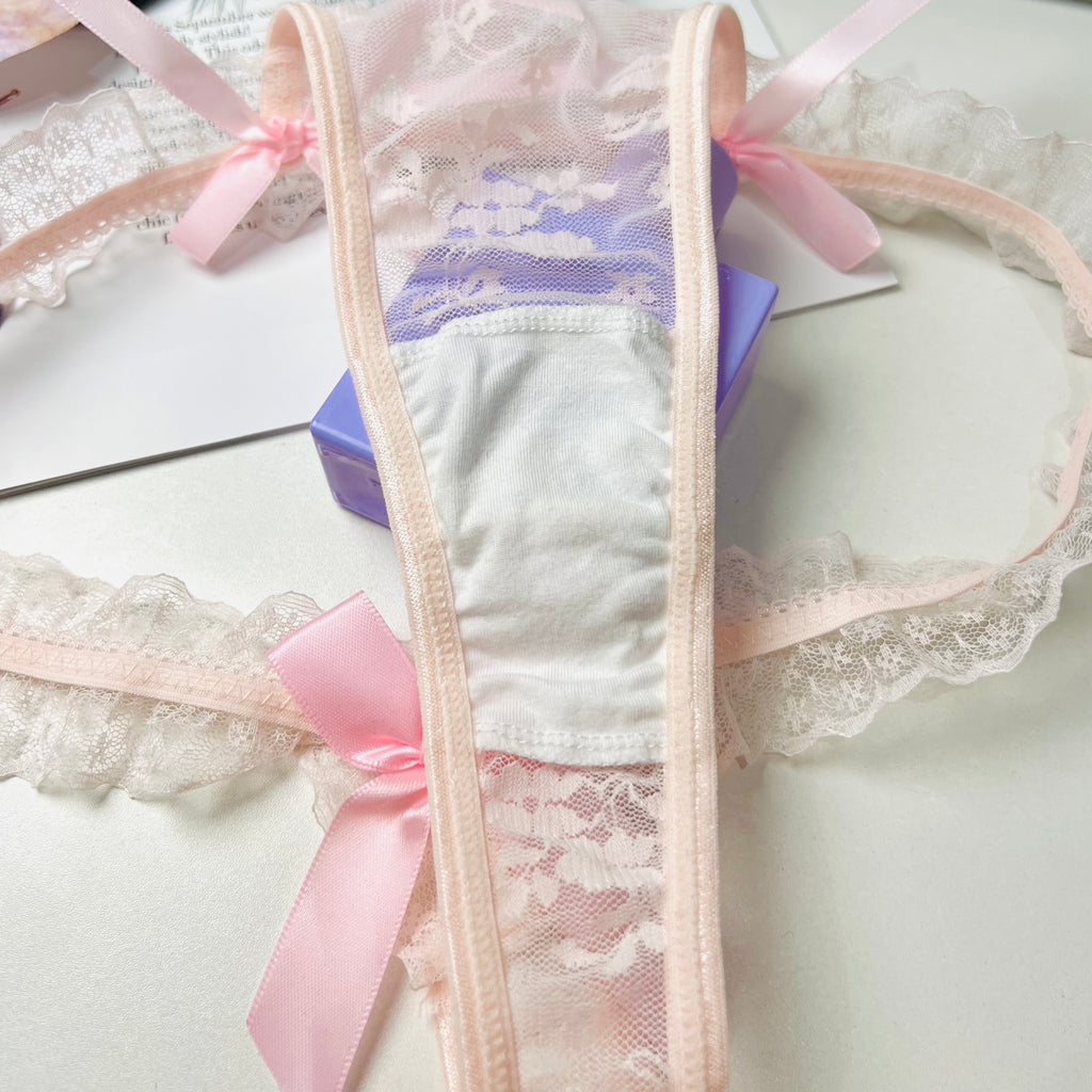 pink lace bow thong lingerie crotch detail close up fabric stitching
