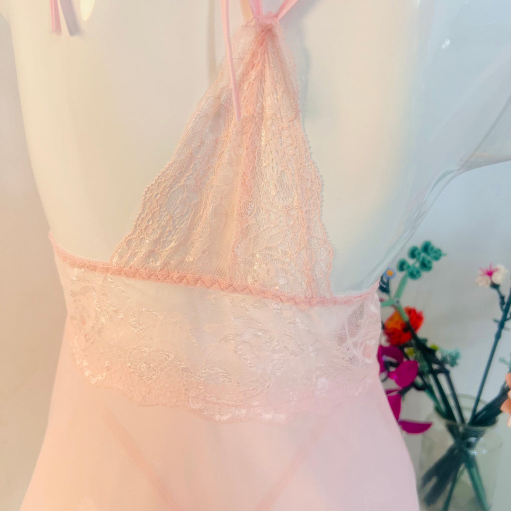close up back design of pink lace sleep dress showing delicate strap detail