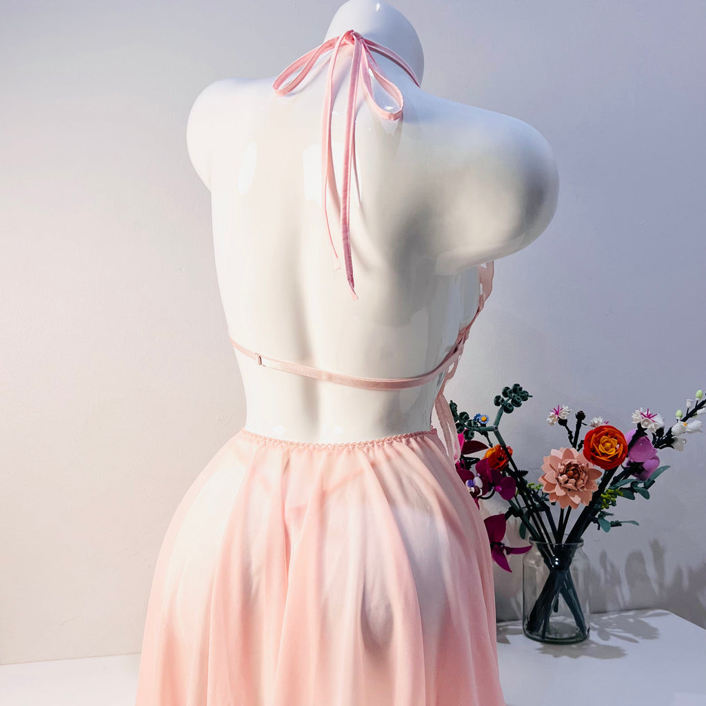 pink lace sleep dress back view highlighting smooth silhouette and thong style