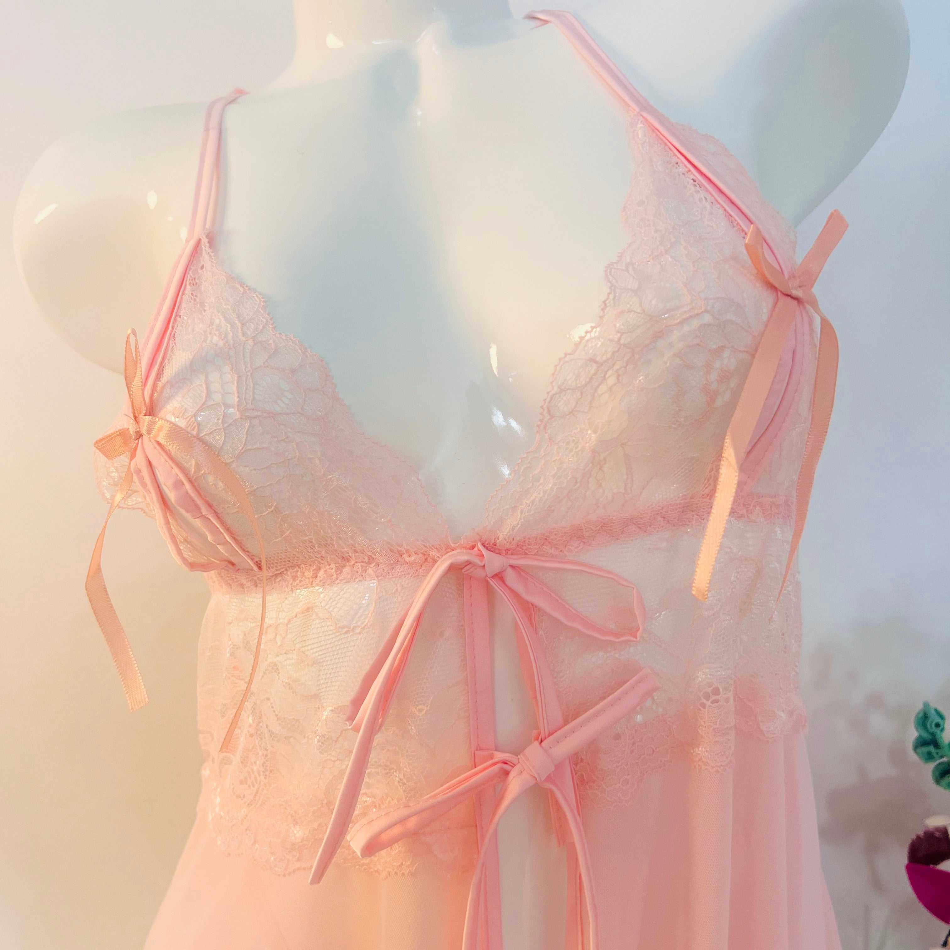 close up lace embroidery on bust area showing soft feminine texture detail