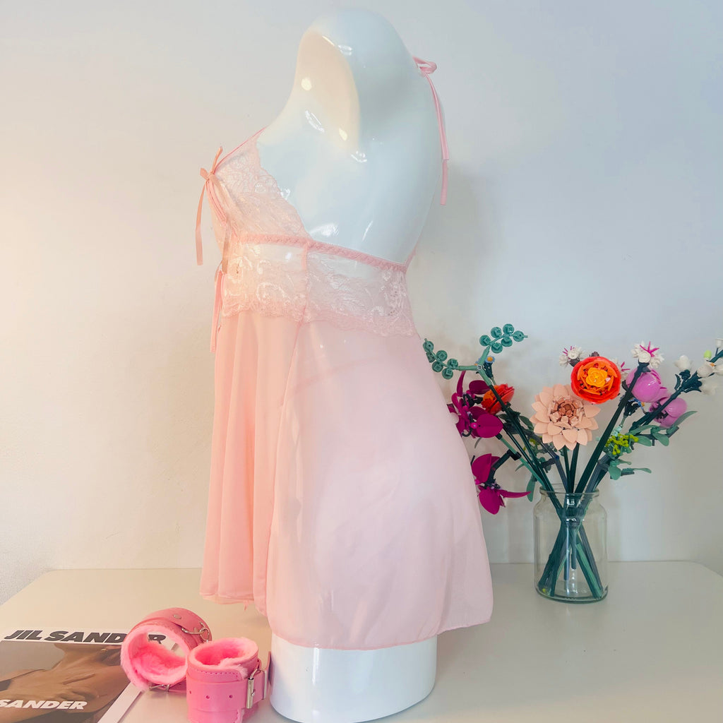 pink lace sleep dress side view showing soft silhouette and body fit