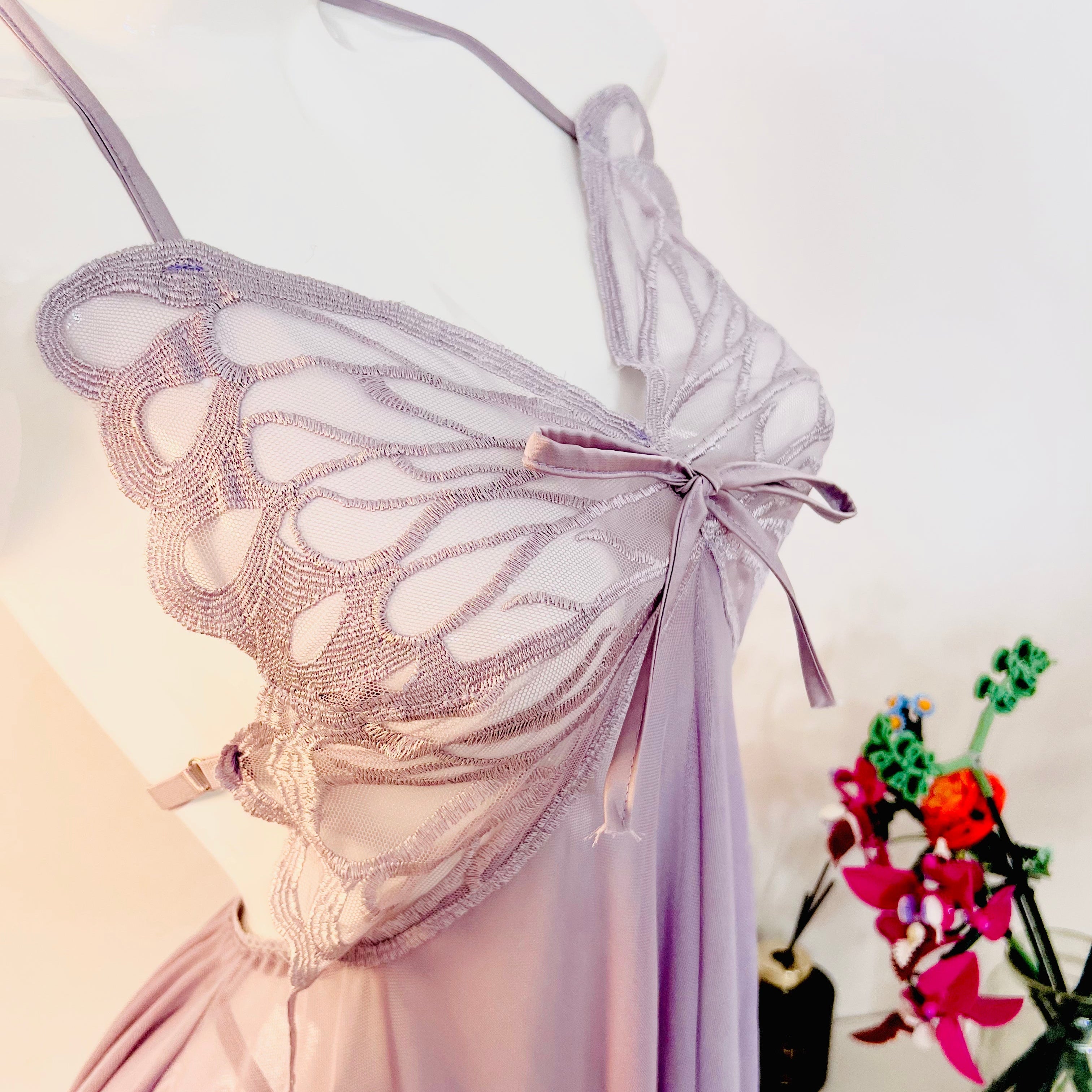 lace detail on bust area of purple sleep dress showing feminine shape and texture