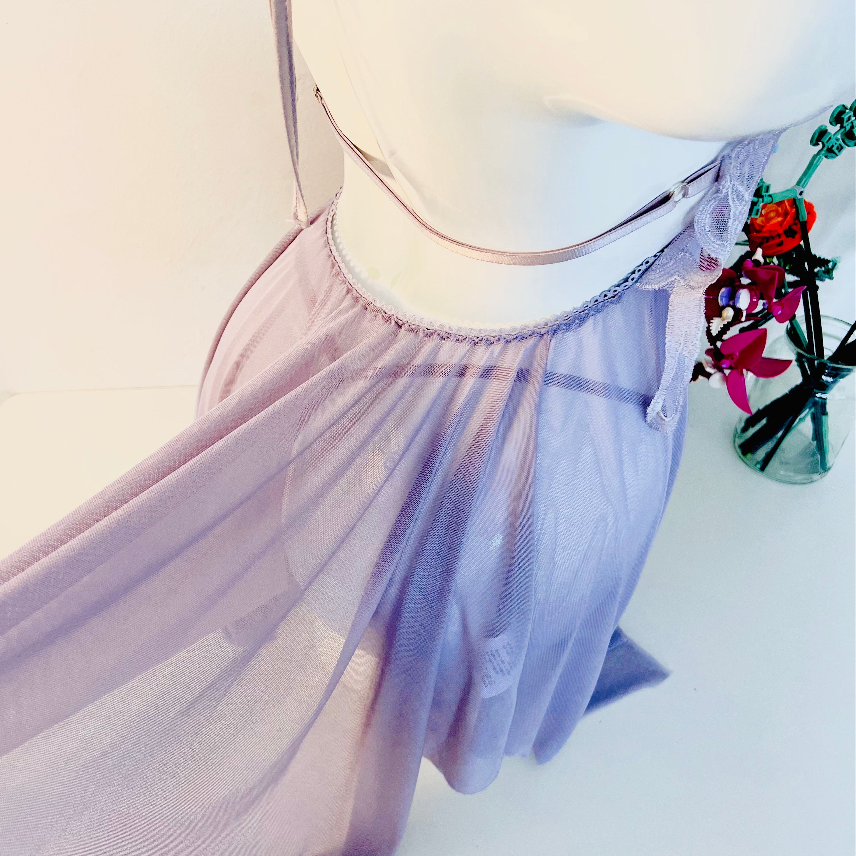 close up of lace hem showing soft flowing fabric and delicate texture