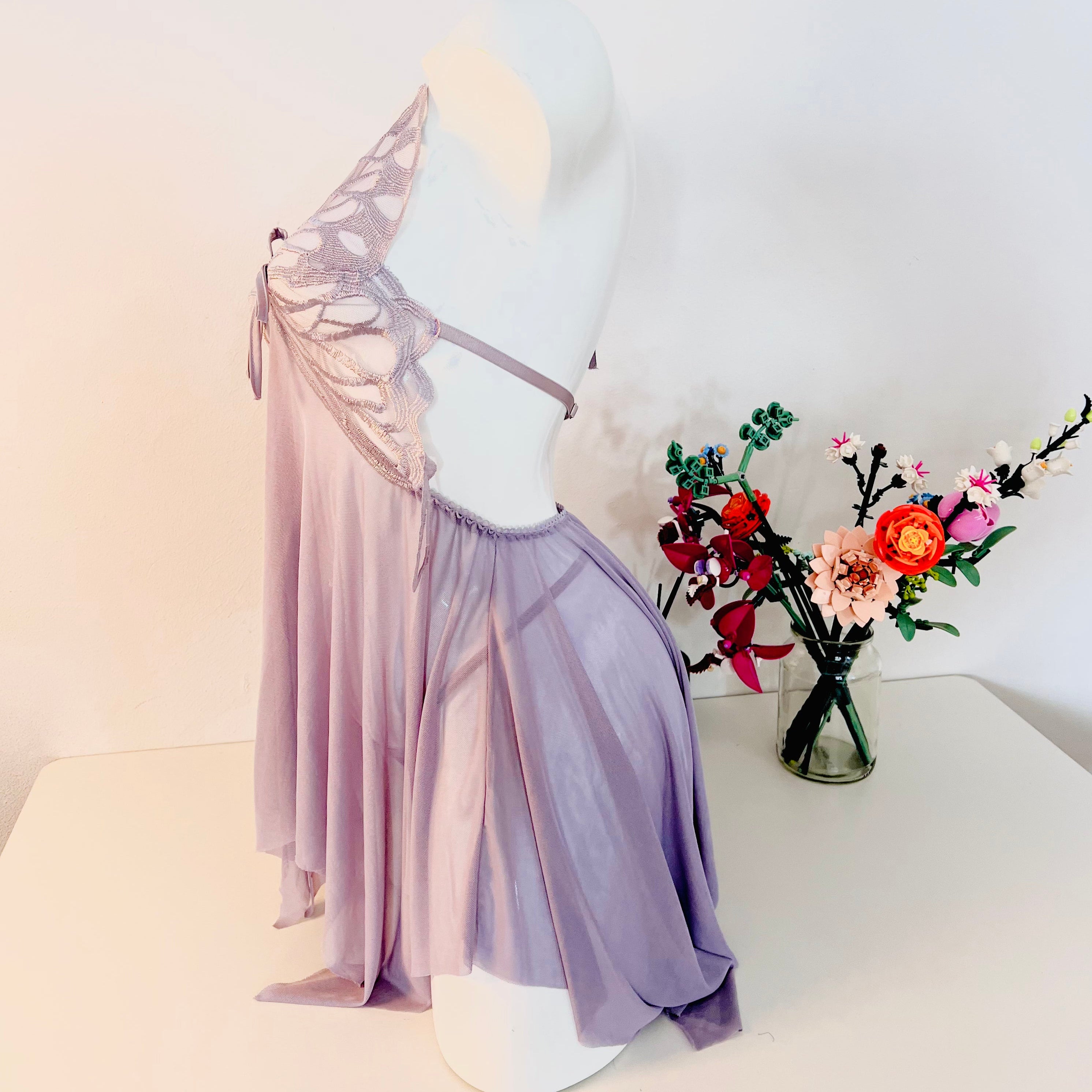 side view of purple lace sleep dress showing gentle silhouette and flow