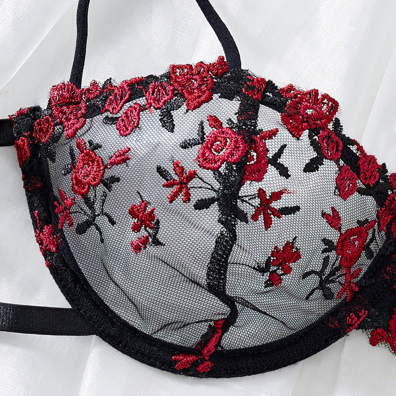 red embroidery lace fabric close up texture detail