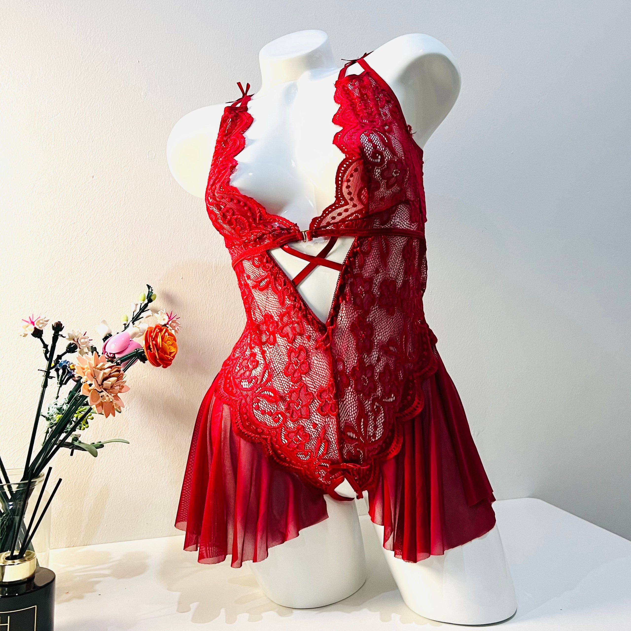 red lace bodysuit worn by model front view bold and sheer lingerie style