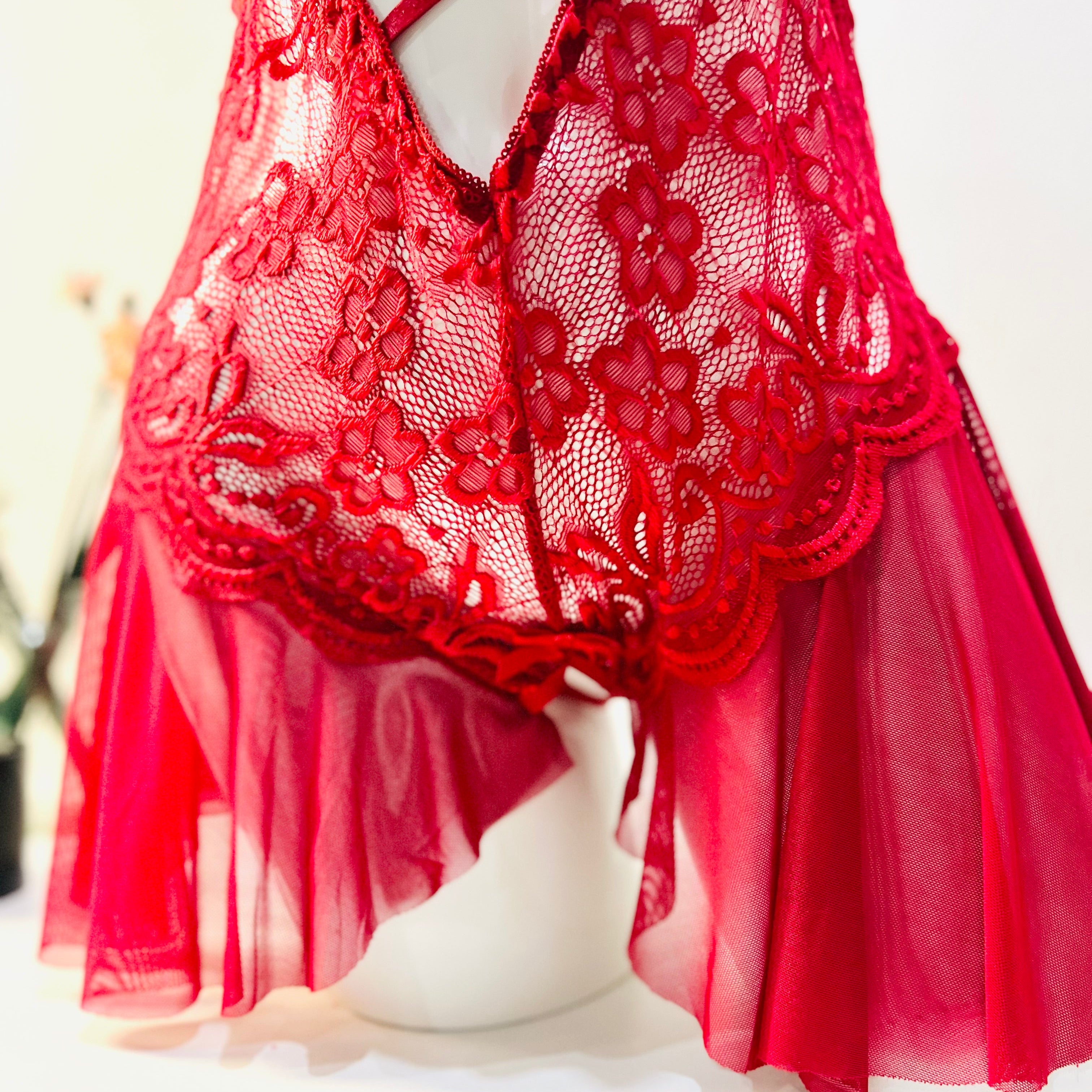lace edge detail of red bodysuit showing soft finish and delicate pattern