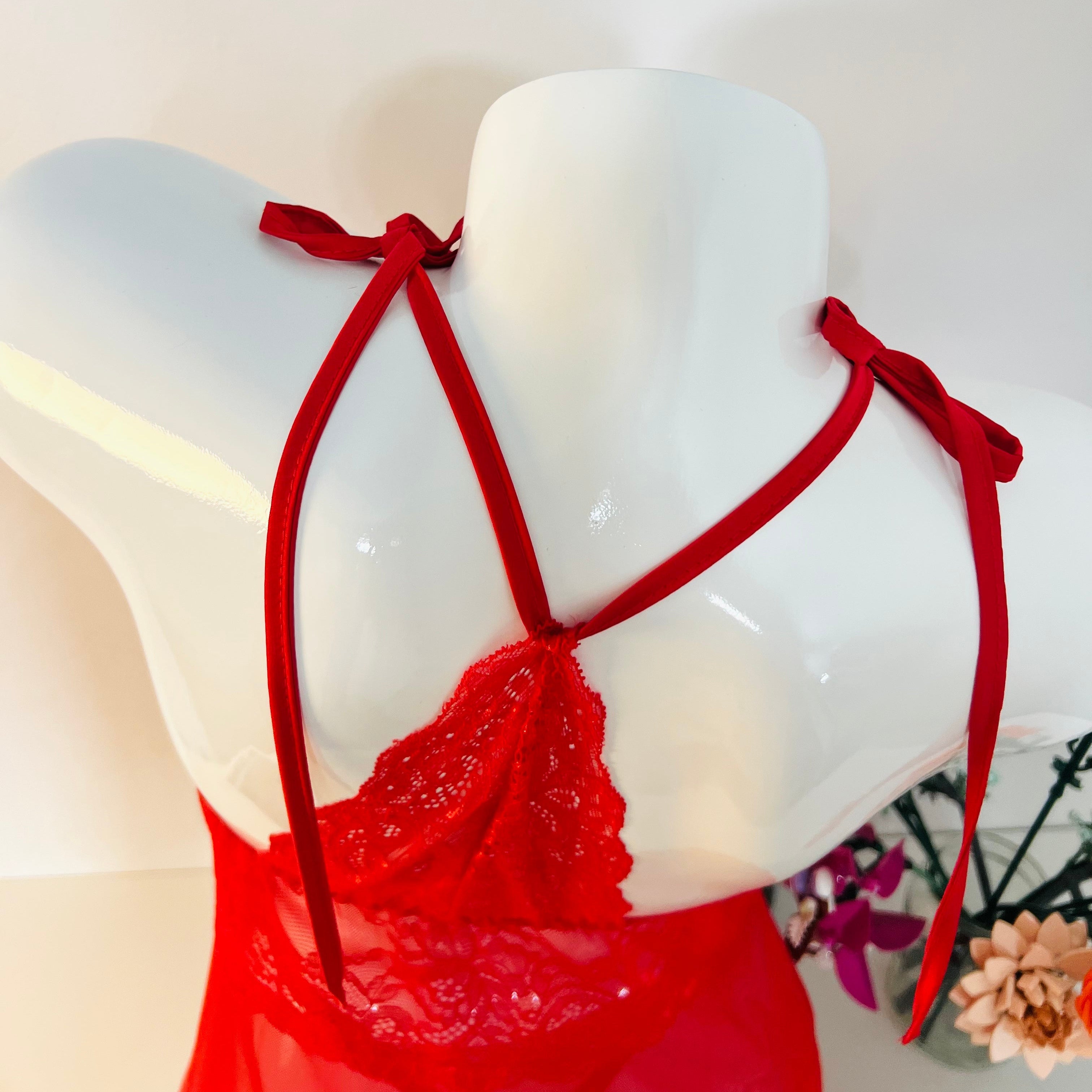 halter strap detail of red lace sleep dress showing adjustable design and fit