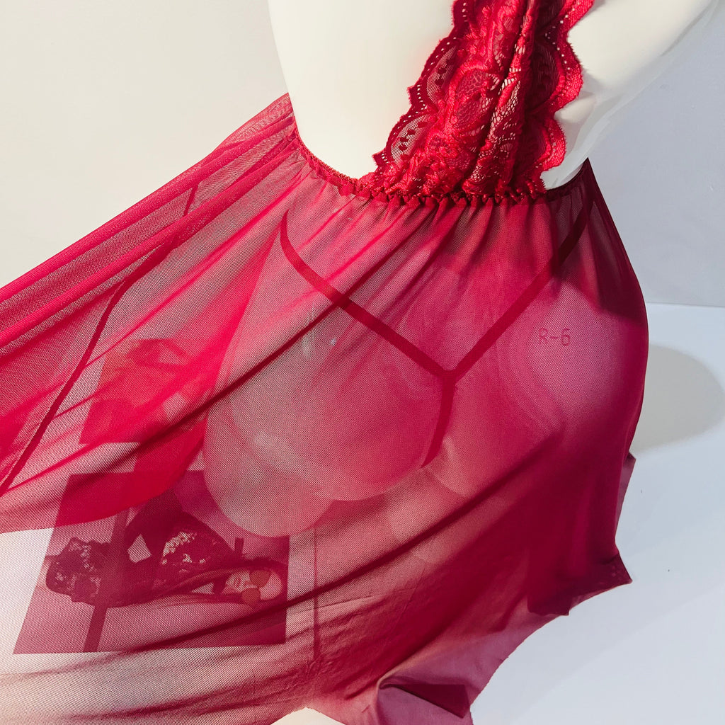 red lace sleep dress hem fabric close up soft lace material detail