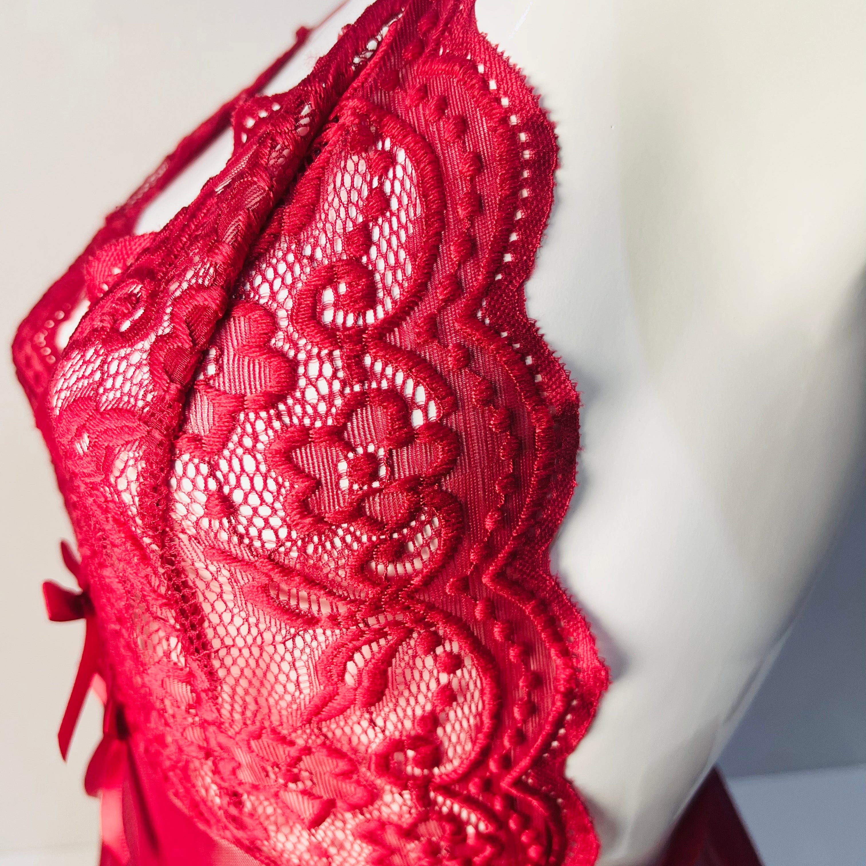 red lace sleep dress side detail close up lace fabric texture