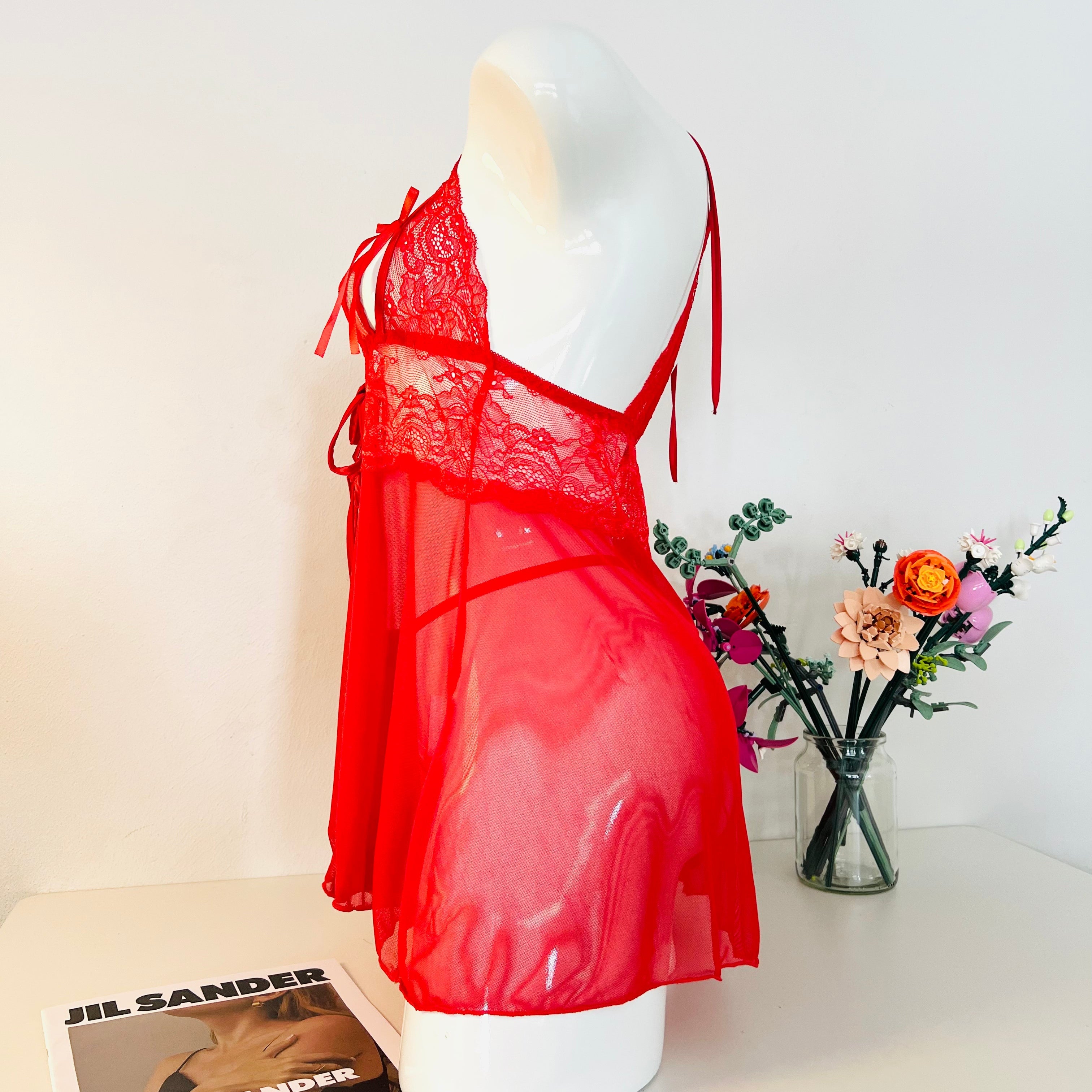 red lace sleep dress side view showing flowy fabric and body fit