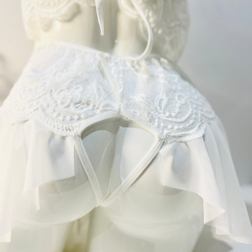 back cut detail of white lace bodysuit highlighting shape and contour fit