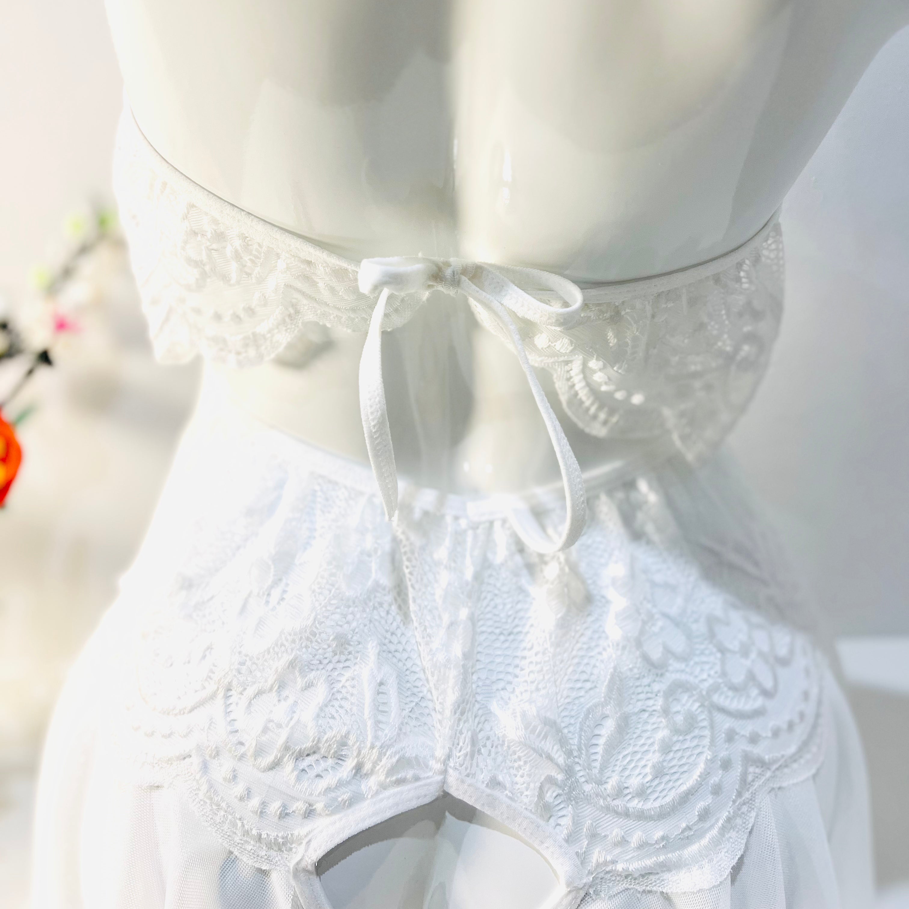 lace up back detail on white bodysuit showing adjustable tie design